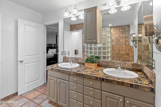 bathroom with decorative backsplash and vanity