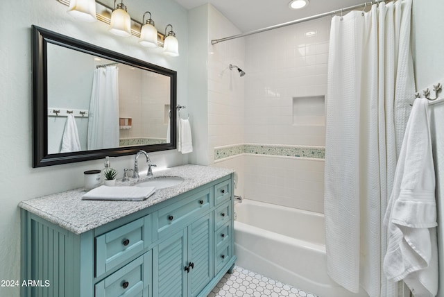 bathroom featuring shower / bath combo and vanity