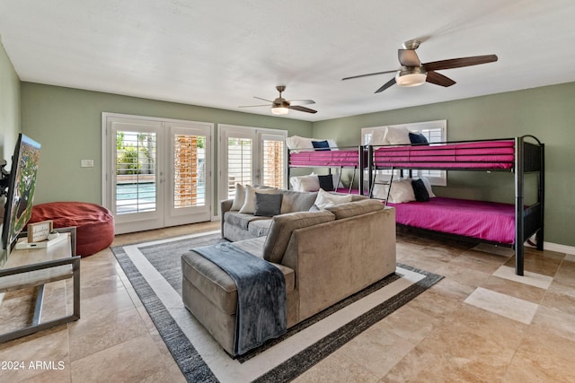 bedroom featuring ceiling fan and access to exterior