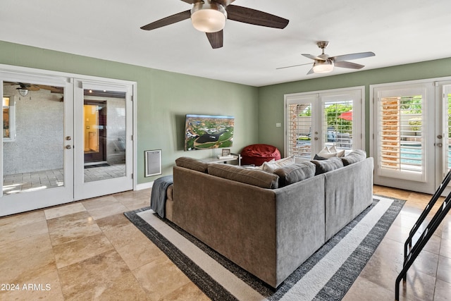 living room featuring french doors and ceiling fan