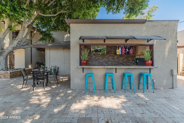 view of patio / terrace with exterior bar