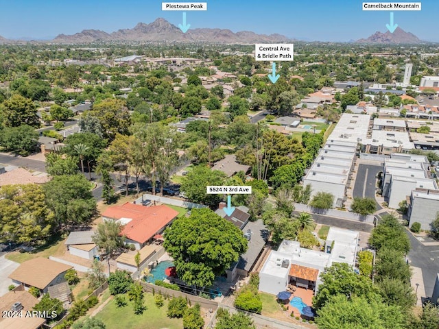 birds eye view of property featuring a mountain view