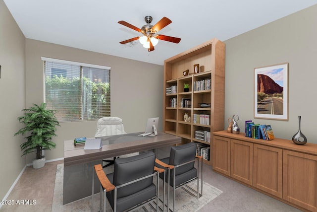 carpeted office with ceiling fan