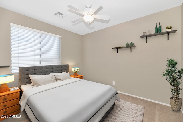 bedroom featuring multiple windows, carpet flooring, and ceiling fan