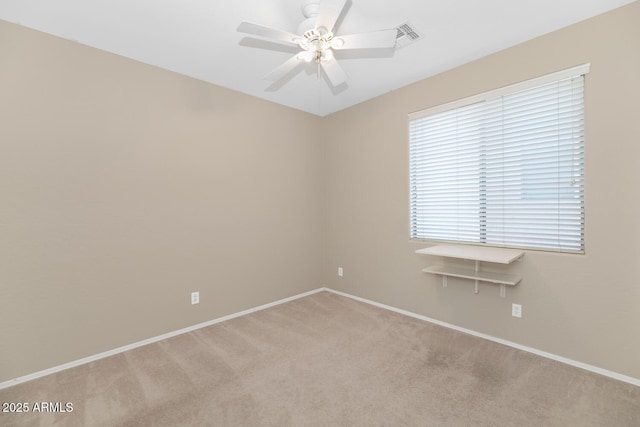 carpeted empty room with ceiling fan