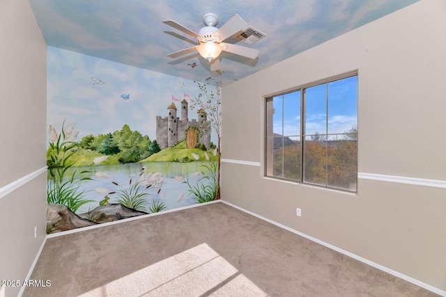 unfurnished room featuring carpet and ceiling fan