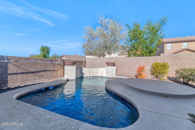 view of pool with pool water feature