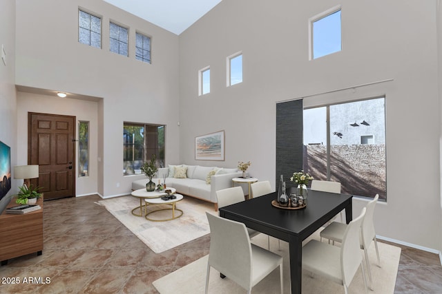 living room featuring a towering ceiling