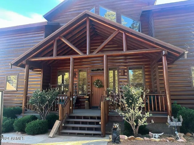 entrance to property with a porch