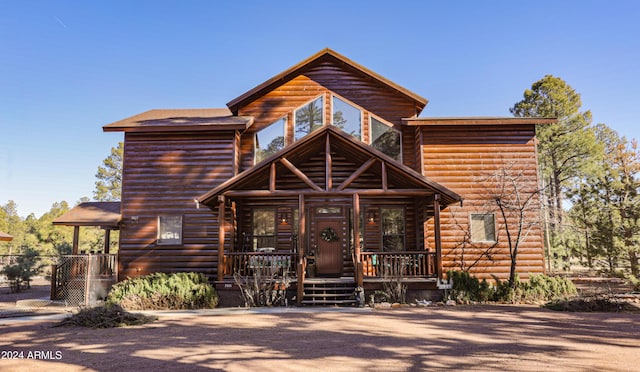 log cabin with a porch