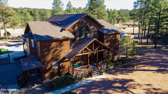 log-style house with a porch