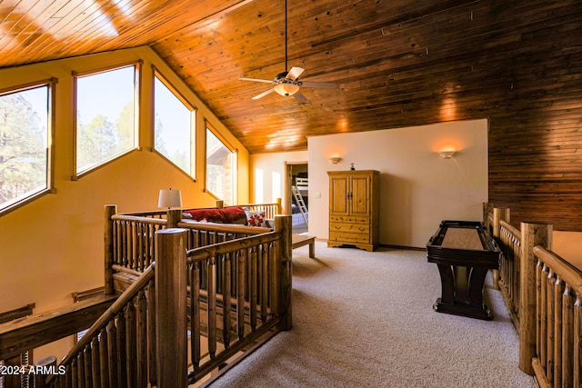 interior space featuring carpet, lofted ceiling, and wooden ceiling