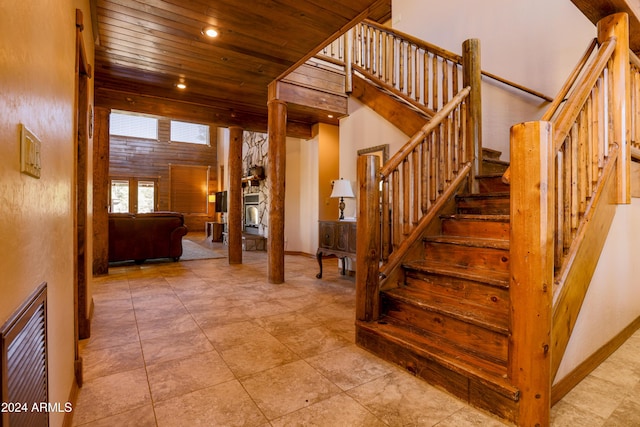 stairs with wooden ceiling