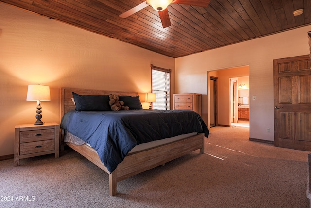 bedroom featuring ensuite bath, ceiling fan, carpet, and wooden ceiling