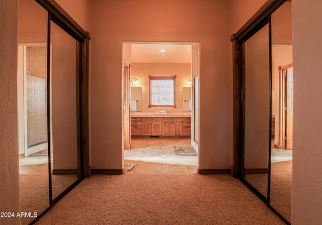 corridor with light carpet