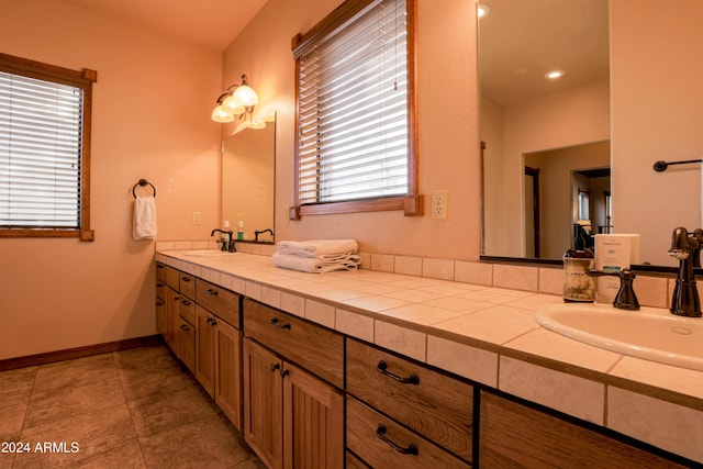 bathroom with tile patterned flooring and vanity