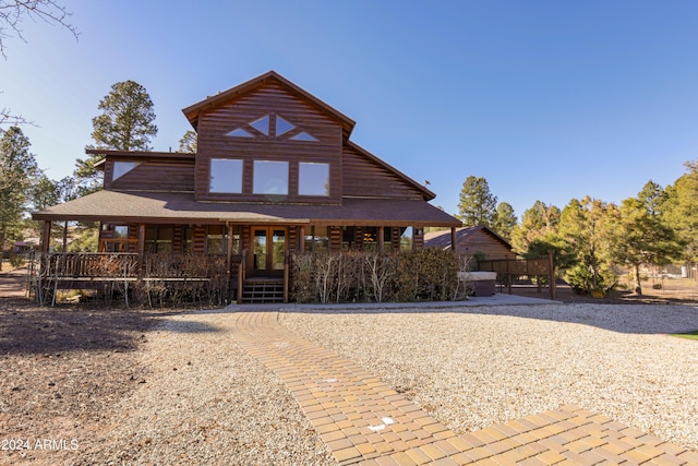 log cabin featuring french doors and a porch