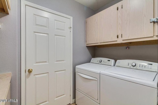 8245 E Bell Rd Unit 103, Scottsdale, AZ 85260 - laundry area featuring cabinet space and independent washer and dryer