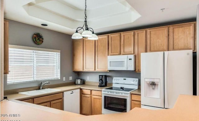 8245 E Bell Rd Unit 103, Scottsdale, AZ 85260 - kitchen featuring white appliances, a sink, a tray ceiling, light countertops, and hanging light fixtures