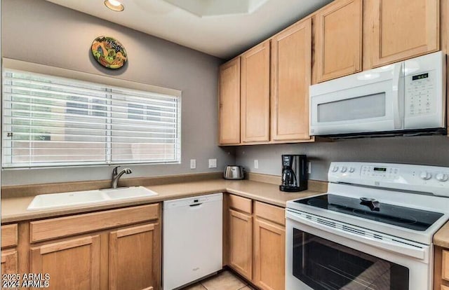 8245 E Bell Rd Unit 103, Scottsdale, AZ 85260 - kitchen with white appliances, a sink, light countertops, and light brown cabinetry