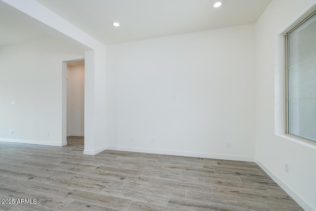 9775 S 36th Ln, Laveen, AZ 85339 - unfurnished room featuring light wood-type flooring, recessed lighting, and baseboards