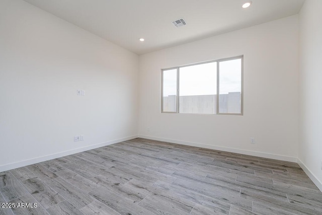 9775 S 36th Ln, Laveen, AZ 85339 - empty room with recessed lighting, light wood-style floors, and baseboards
