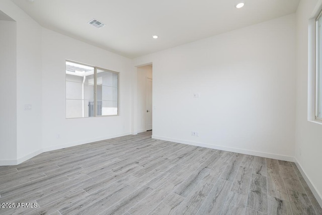 9775 S 36th Ln, Laveen, AZ 85339 - spare room featuring light wood-type flooring, recessed lighting, and baseboards