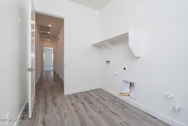 9775 S 36th Ln, Laveen, AZ 85339 - laundry area with gas dryer hookup, electric dryer hookup, washer hookup, light wood-type flooring, and baseboards