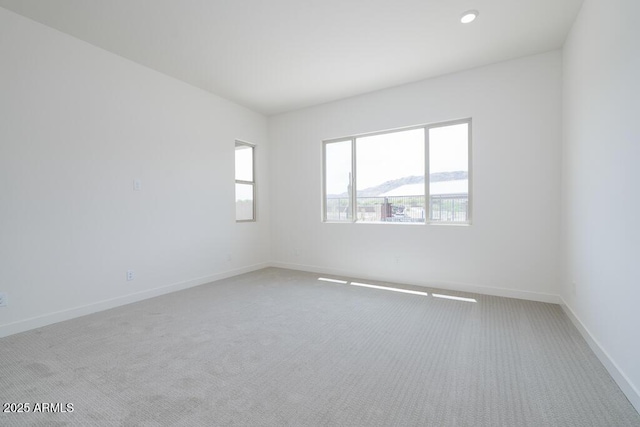 9775 S 36th Ln, Laveen, AZ 85339 - spare room featuring carpet, healthy amount of natural light, and baseboards
