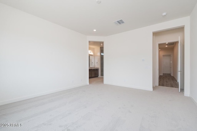 9775 S 36th Ln, Laveen, AZ 85339 - unfurnished room with light colored carpet, baseboards, and recessed lighting