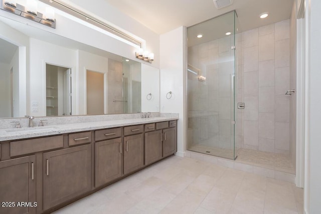 9775 S 36th Ln, Laveen, AZ 85339 - bathroom with double vanity, a stall shower, and recessed lighting