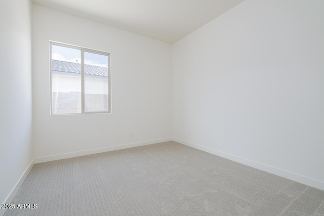 9775 S 36th Ln, Laveen, AZ 85339 - empty room featuring light carpet and baseboards