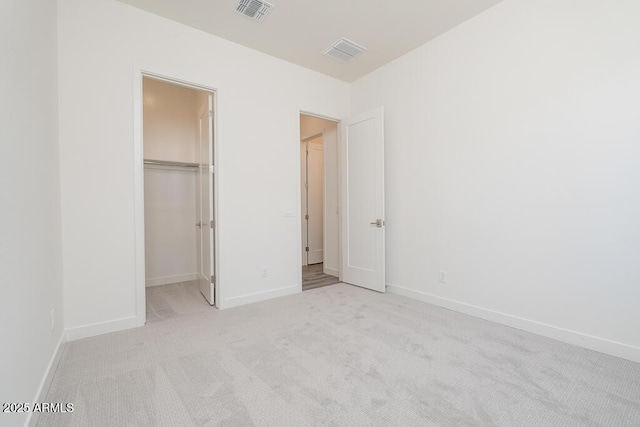 9775 S 36th Ln, Laveen, AZ 85339 - unfurnished bedroom with carpet, a walk in closet, baseboards, and a closet
