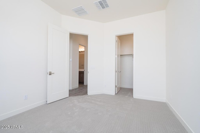 9775 S 36th Ln, Laveen, AZ 85339 - unfurnished bedroom featuring carpet floors, baseboards, and connected bathroom