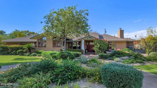 ranch-style home with a front yard