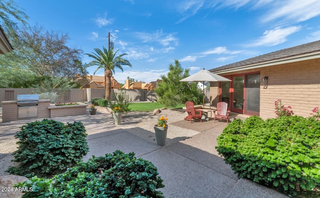 view of patio with a grill