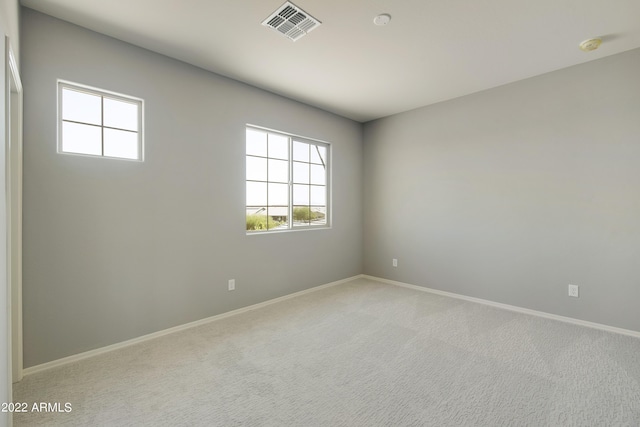 empty room with light colored carpet