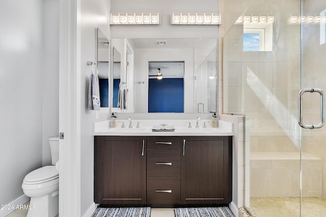 full bath with visible vents, a sink, a shower stall, and toilet