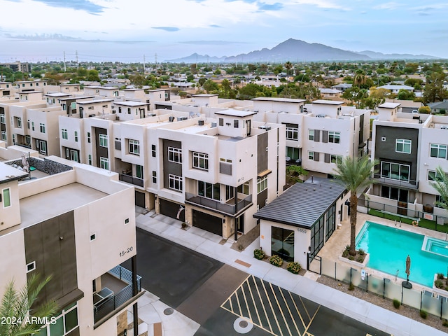 birds eye view of property with a mountain view