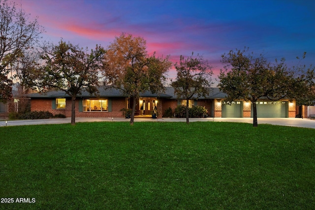 ranch-style home with a yard