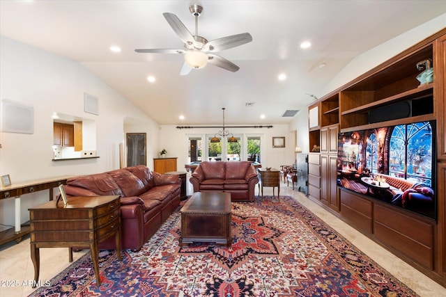 tiled living room with french doors, ceiling fan, and lofted ceiling