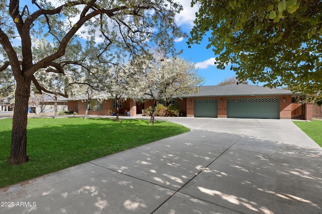 view of front of house with a garage and a front lawn