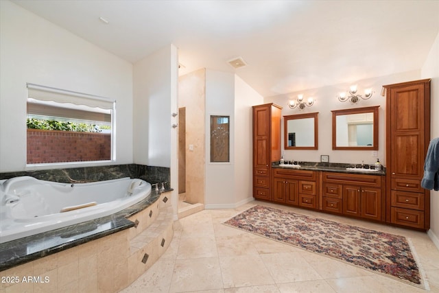 bathroom with tile patterned flooring, vanity, vaulted ceiling, and plus walk in shower