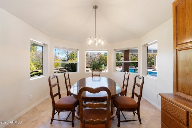 dining room with a notable chandelier