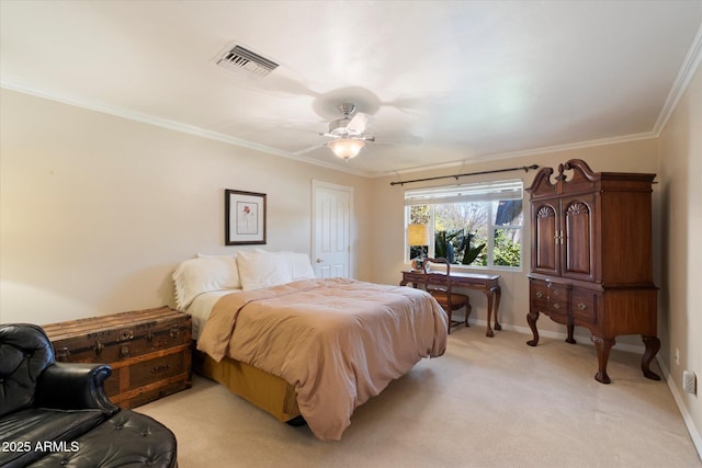 carpeted bedroom with ornamental molding and ceiling fan