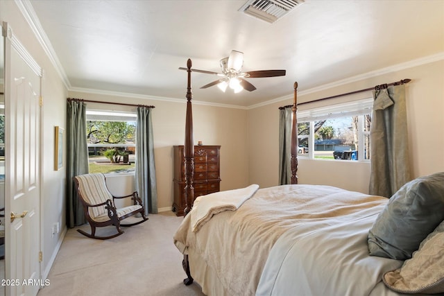 carpeted bedroom with ceiling fan, ornamental molding, and multiple windows