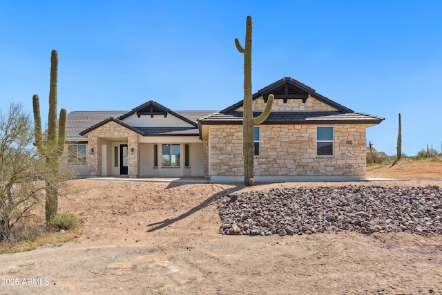 740 W Patrick Pl, San Tan Valley, AZ 85143 - view of front facade featuring stone siding and a tile roof