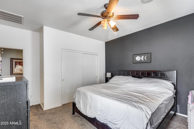 6328 W Fawn Dr, Laveen, AZ 85339 - bedroom with carpet floors, a ceiling fan, visible vents, and a closet