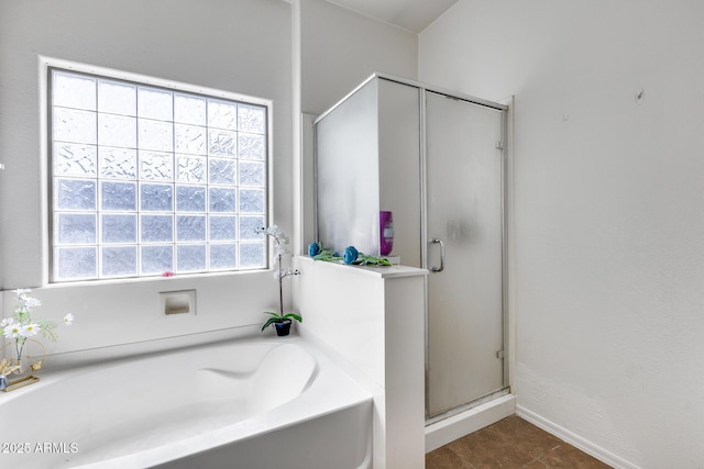 6328 W Fawn Dr, Laveen, AZ 85339 - bathroom featuring baseboards, a shower stall, and a bath