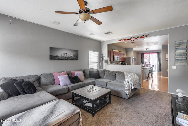 6328 W Fawn Dr, Laveen, AZ 85339 - living area featuring ceiling fan, light carpet, and visible vents